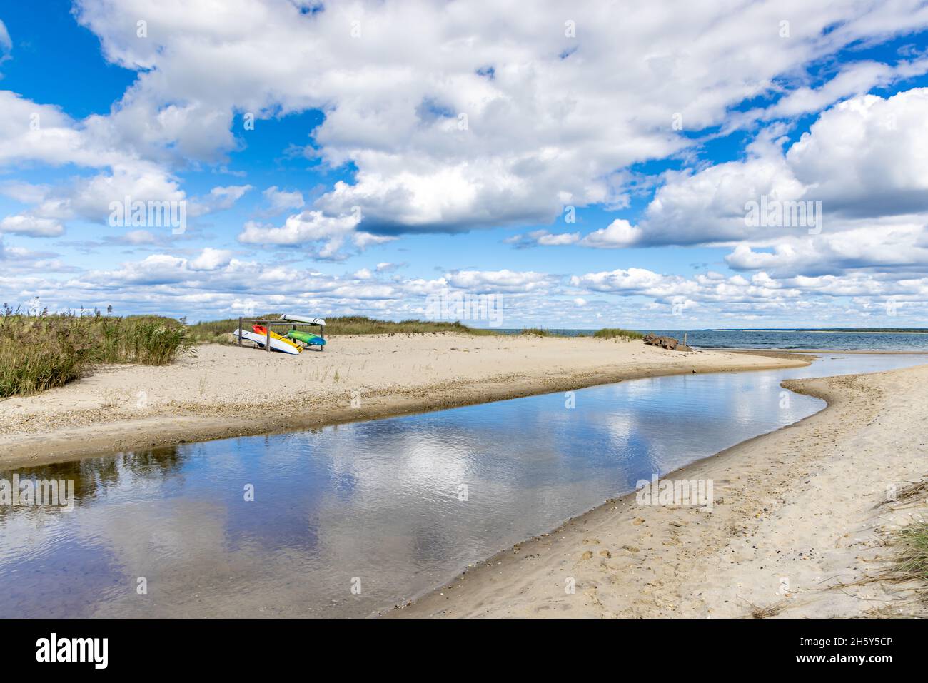 Landscape with water and kayaks at Fresh Pond Park in Amagansett, NY Stock Photo