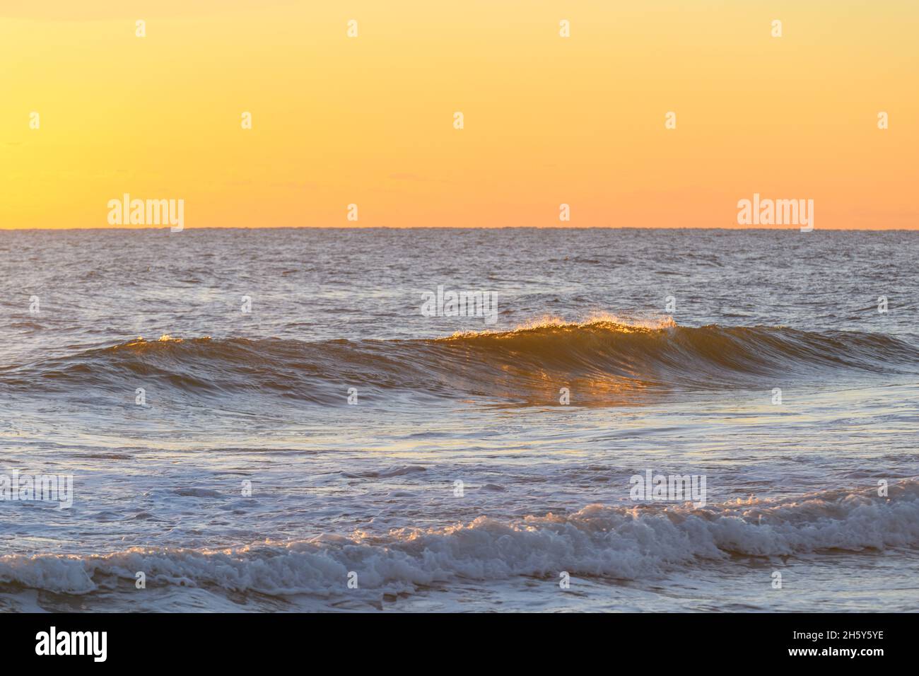 Waves crashing at sunrise, Atlantic Ocean, North Carolina, Outer Banks Stock Photo