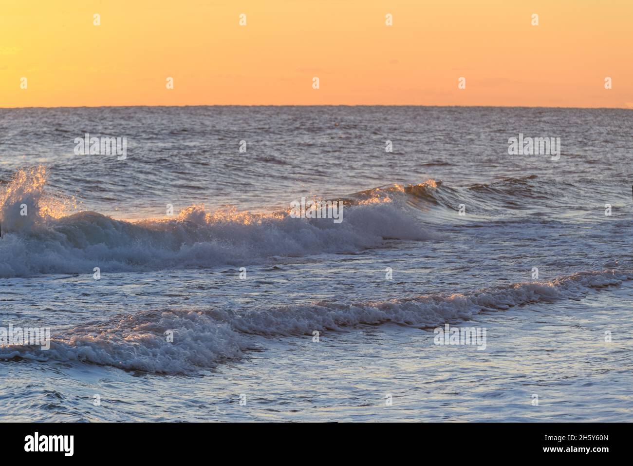 Waves crashing at sunrise, Atlantic Ocean, North Carolina, Outer Banks Stock Photo