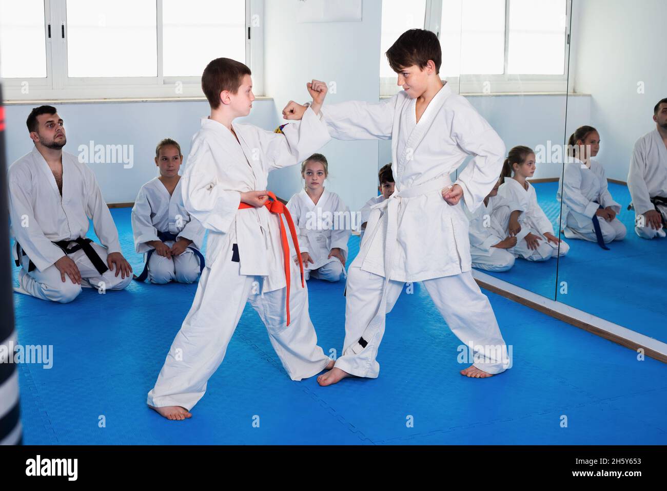 Pair of boys fighting in sparring to use new moves Stock Photo - Alamy