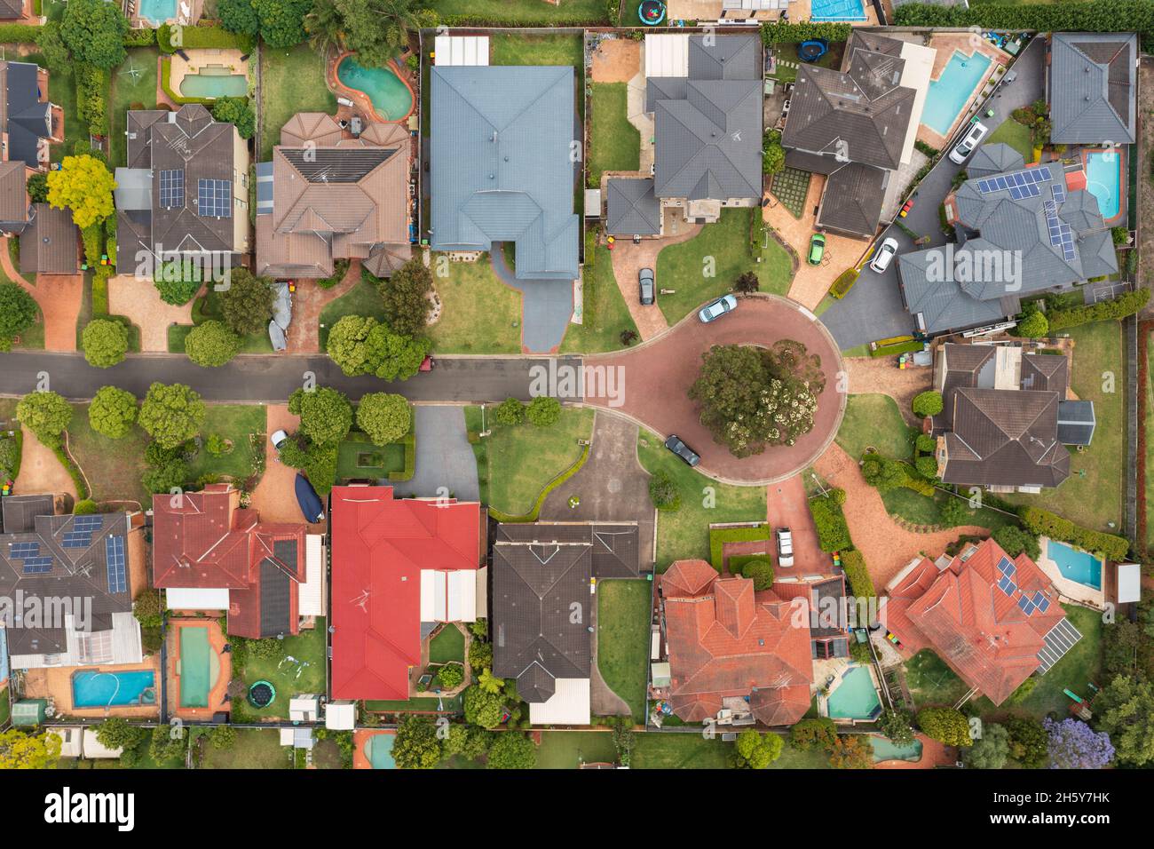 Top down aerial view of a residential cul-de-sac with houses, swimming pools and gardens in outer Sydney suburb of Kellyville, NSW, Australia. Stock Photo