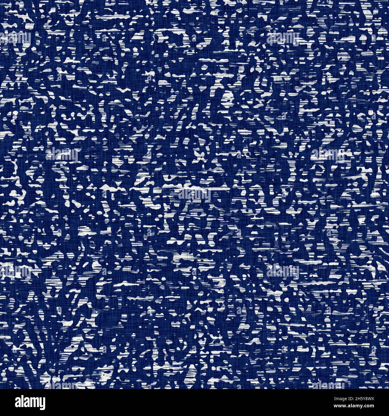 Indigo dyed fabric random flecks pattern texture. Seamless textile