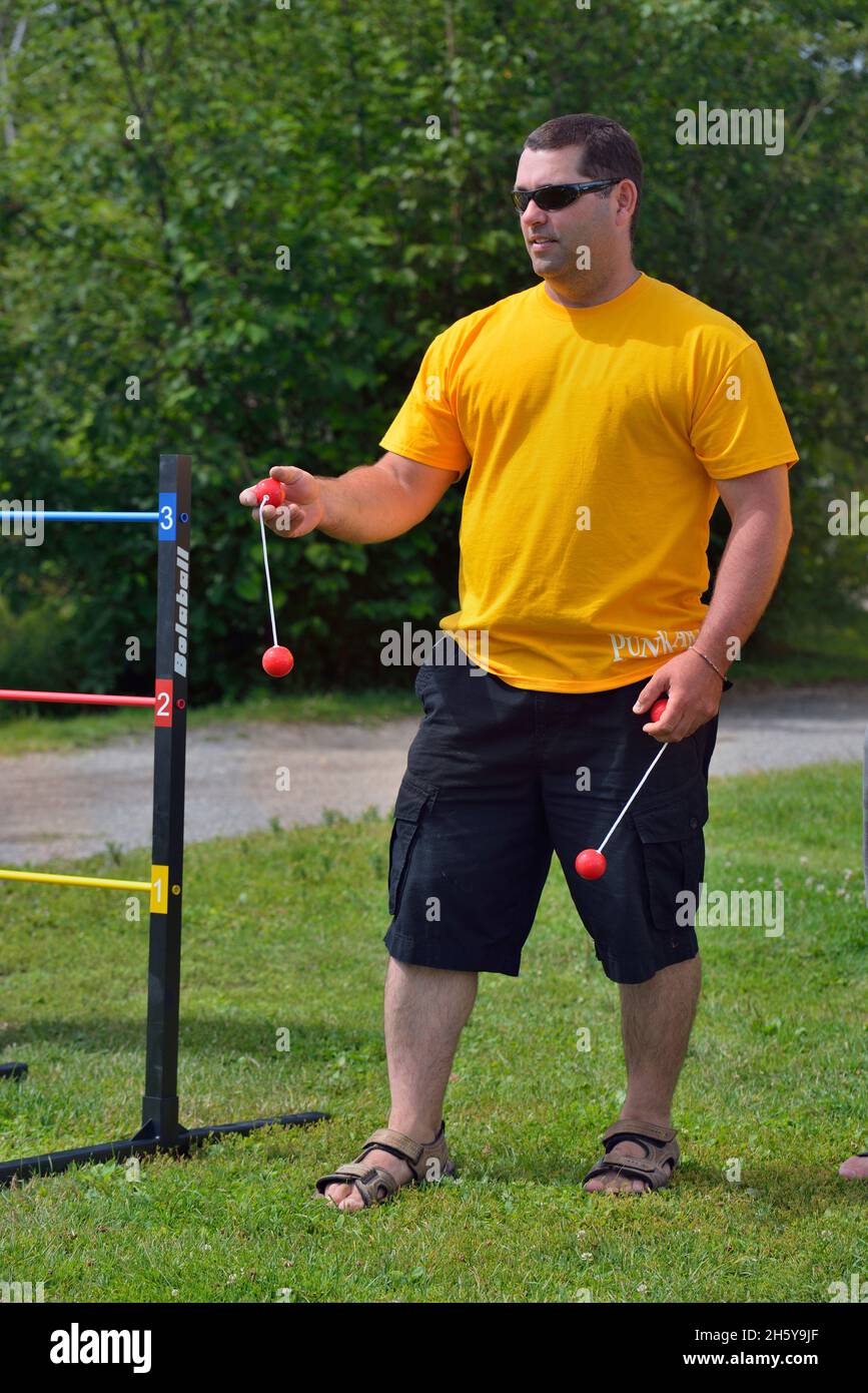 Candid portrait from a family gathering. Outdoor game, Greater Sudbury, Ontario, Canada Stock Photo