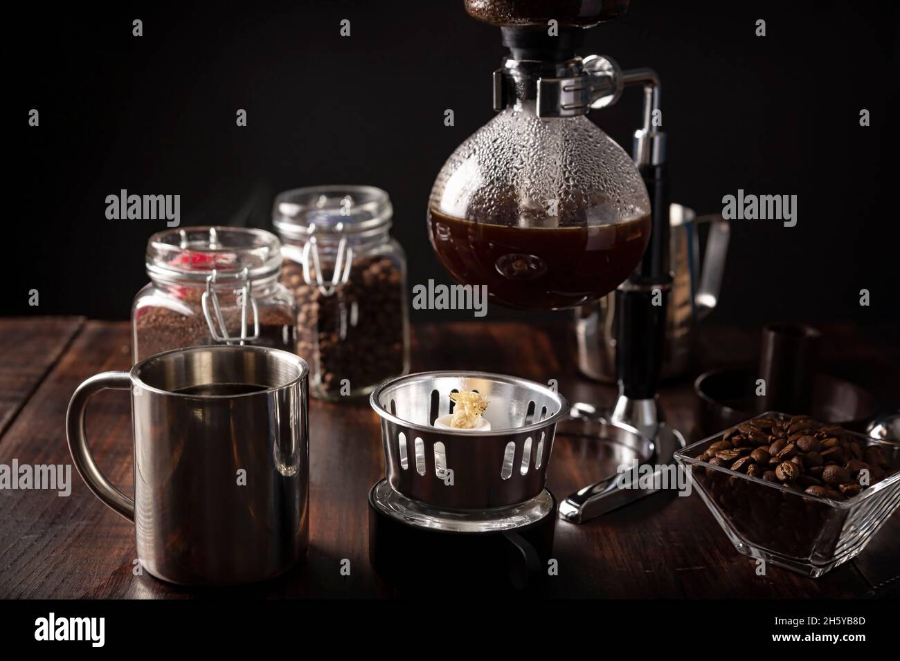Black portable cappuccino maker on chrome stand frontal view isolated on  white background. The device for whipping cream for coffee - cappuccinatore  Stock Photo - Alamy