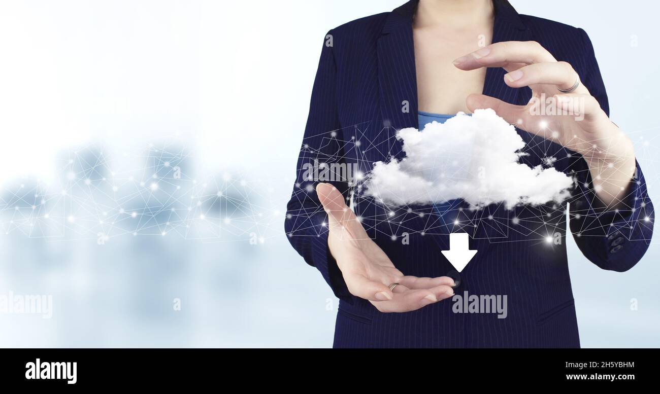 Two hand holding virtual holographic cloud, download, data icon with light blurred background. Cloud computing technology internet concept background Stock Photo