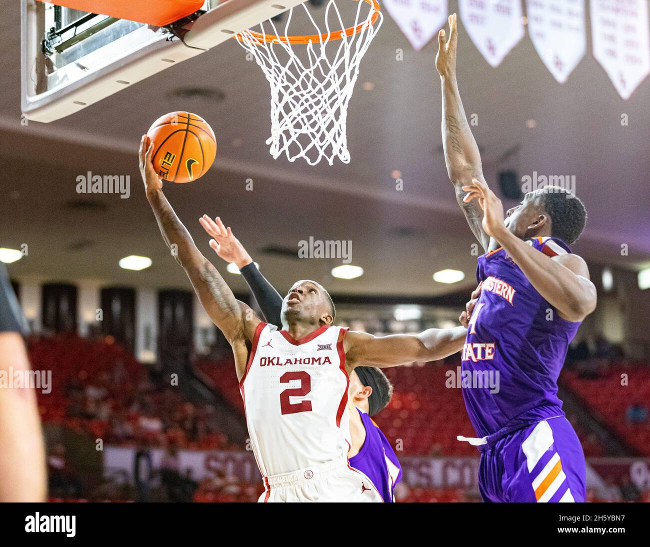 Norman, Oklahoma, USA. 9th Nov, 2021. Oklahoma Sooners guard Umoja Gibson (2) goes up for the basketball against the Northwestern State Demons on Tuesday, November 9, 2021 at the Lloyd Noble Center in Norman, Oklahoma. (Credit Image: © Nicholas Rutledge/ZUMA Press Wire) Stock Photo