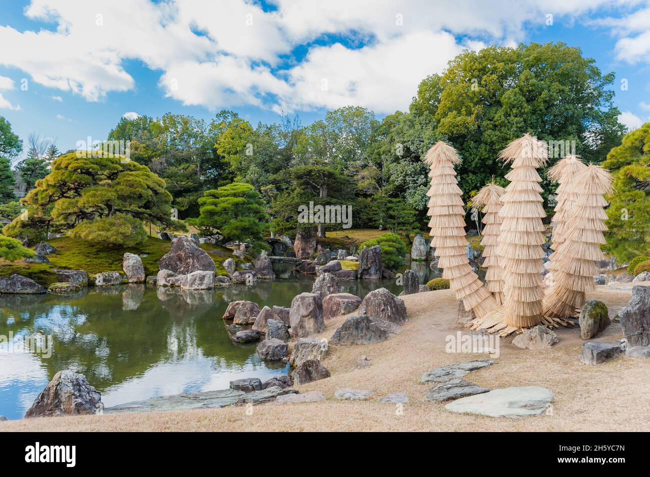 Beautiful, artistic straw structures adorn the spectacular and formal designs of the Nijo Castle imperial gardens in Kyoto, Japan. Stock Photo