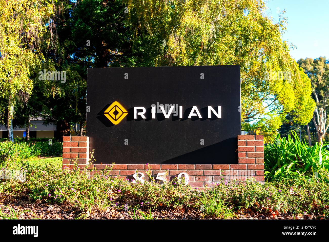 Rivian sign logo at headquarters in Silicon Valley. Rivian is an American electric vehicle automaker and automotive technology company Palo Alto Ca Stock Photo Alamy