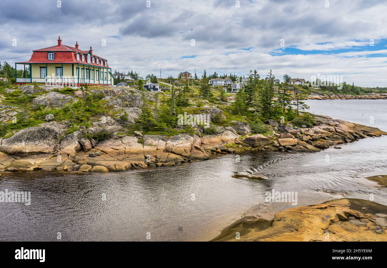 View on Baie Johan Beetz historic house on the shore of the St Lawrence river, in Cote Nord