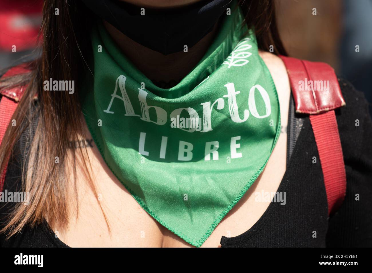 Bogota, Colombia. 11th Nov, 2021. A demonstrator has a scarf that reads 'Freedom for abortions' as activists from feminist and pro-abortion groups participate in a demonstration in support of the ldecriminalization of Abortions outside the Colombian Constitutional Court house in Bogota, Colombia on November 11, 2021. Credit: Long Visual Press/Alamy Live News Stock Photo