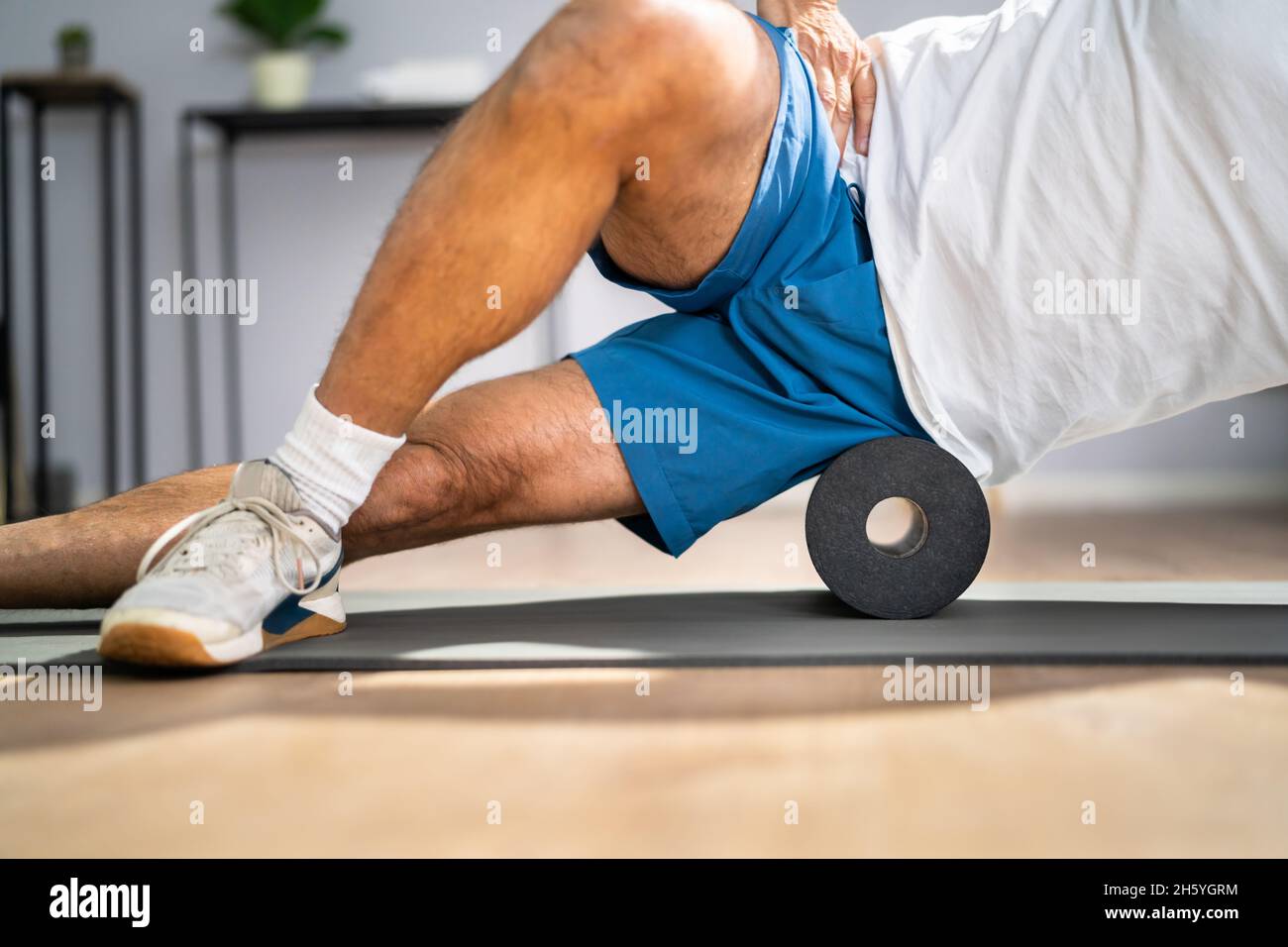 Foam Roller Healthy Leg Workout Sport Training On Floor Stock Photo