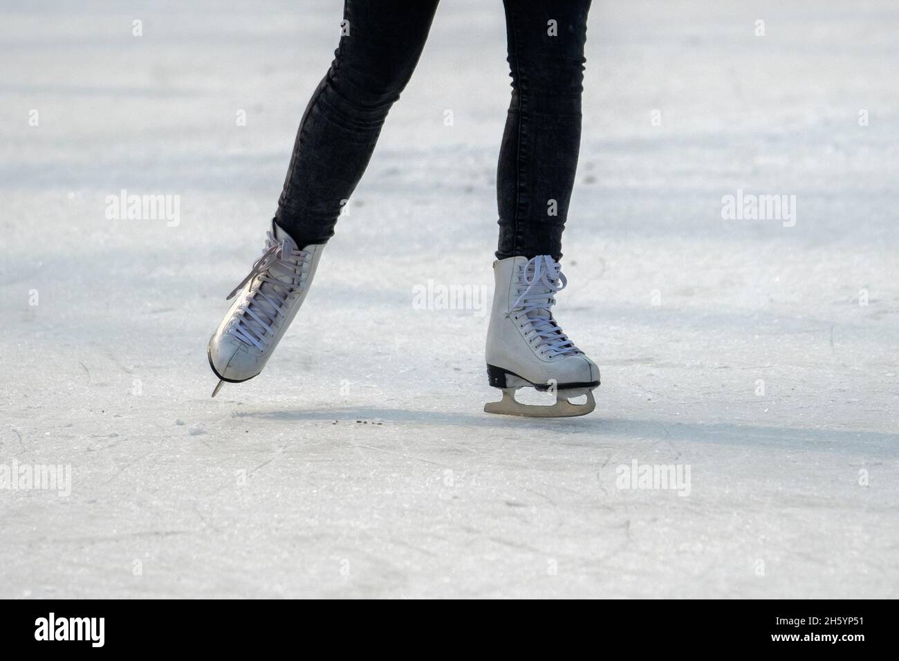 Feet in the skates on ice Stock Photo Alamy