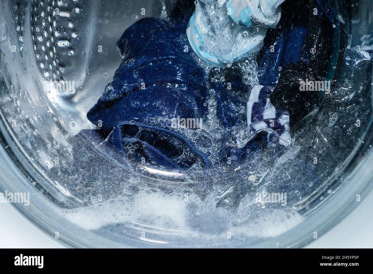 Linen washing in the washing machine. Stock Photo