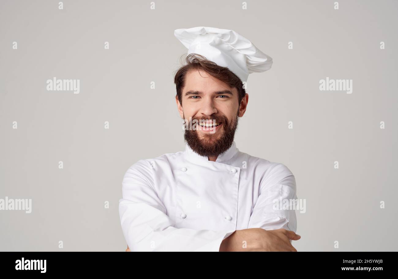 male cook Chef uniform Cooking emotions light background Stock Photo ...
