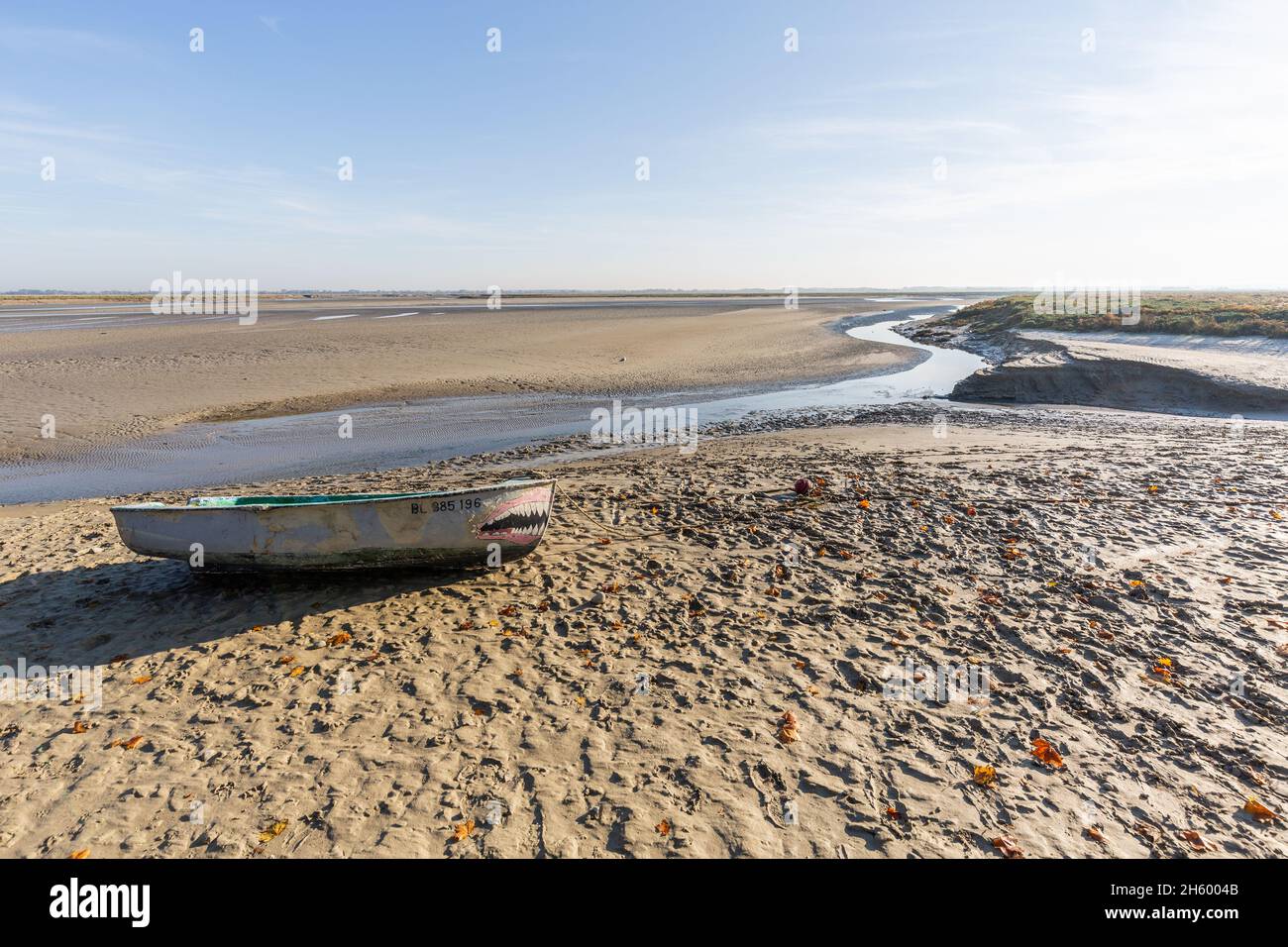 Rowboat beached in the Baie de Somme at low tide. Saint-Valery, France Stock Photo