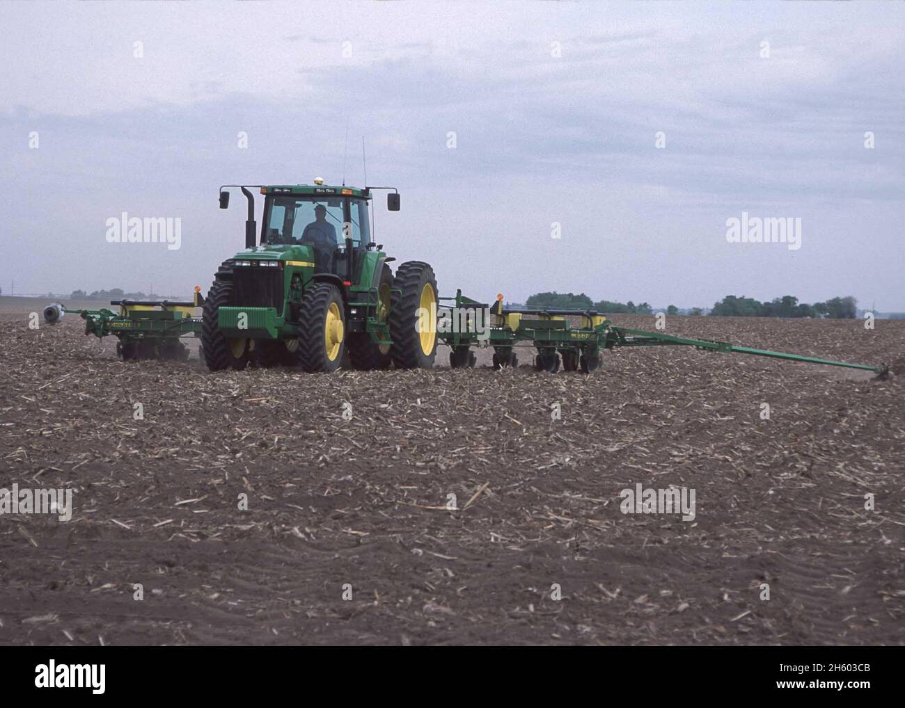 A farmer in his field in a John Deere tractor ca. 2011 or earlier Stock ...