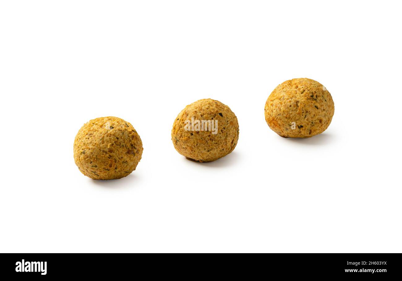 Three falafels, deepfried balls of crushed legumes, chickpeas on a