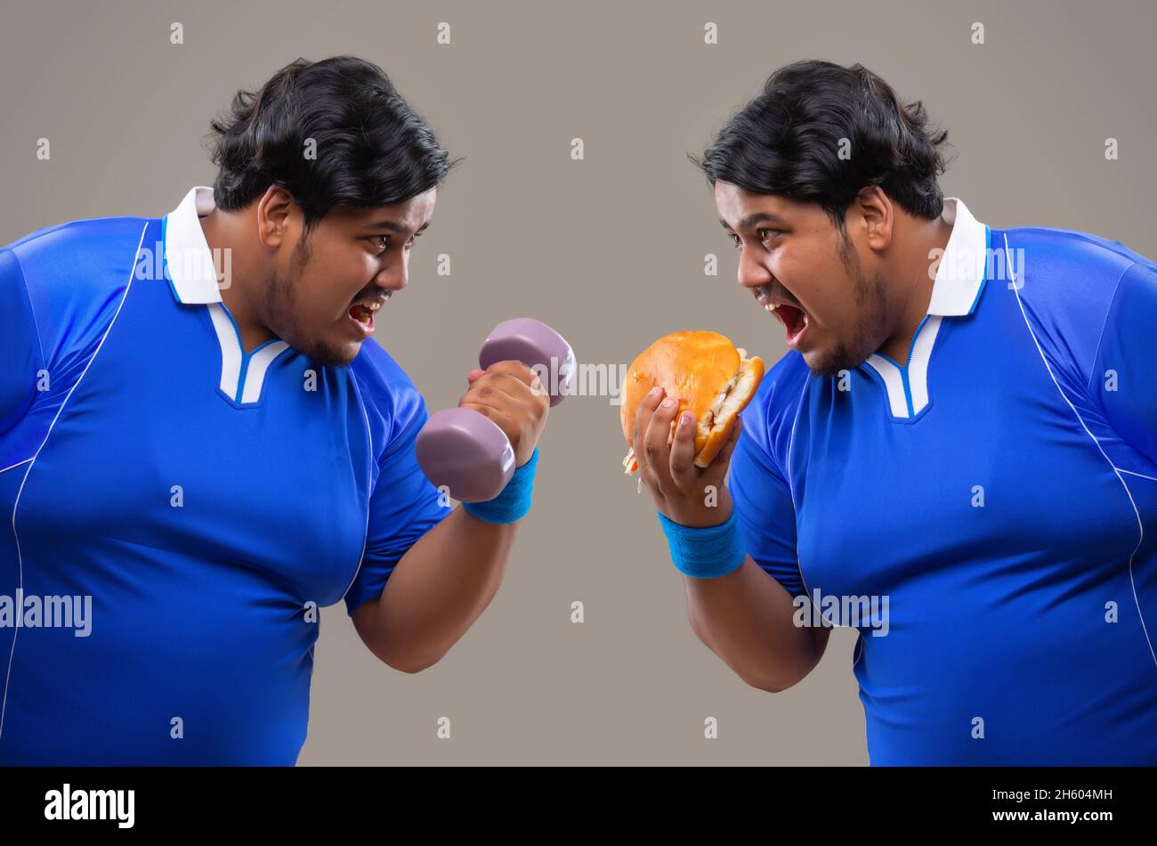 Contrast of fat man holding dumbles against him eating burger. Stock Photo