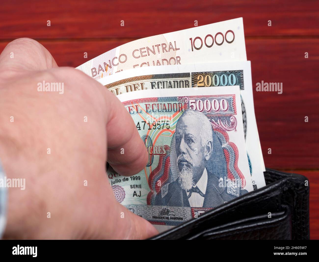 Ecuadorian money - sucre in the black wallet Stock Photo