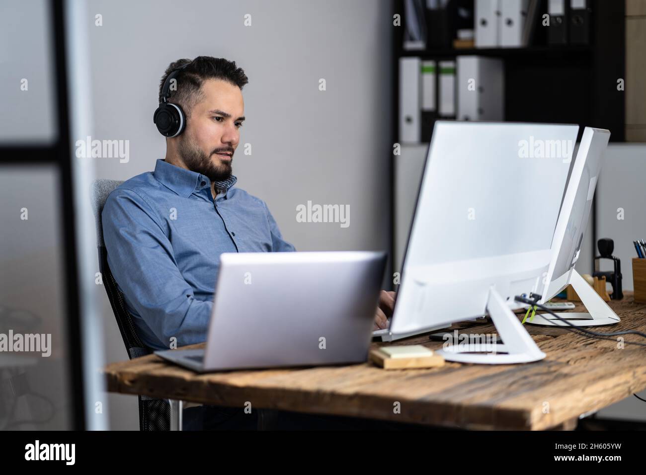 Employee Working On Desktop Computer In Home Office Stock Photo Alamy