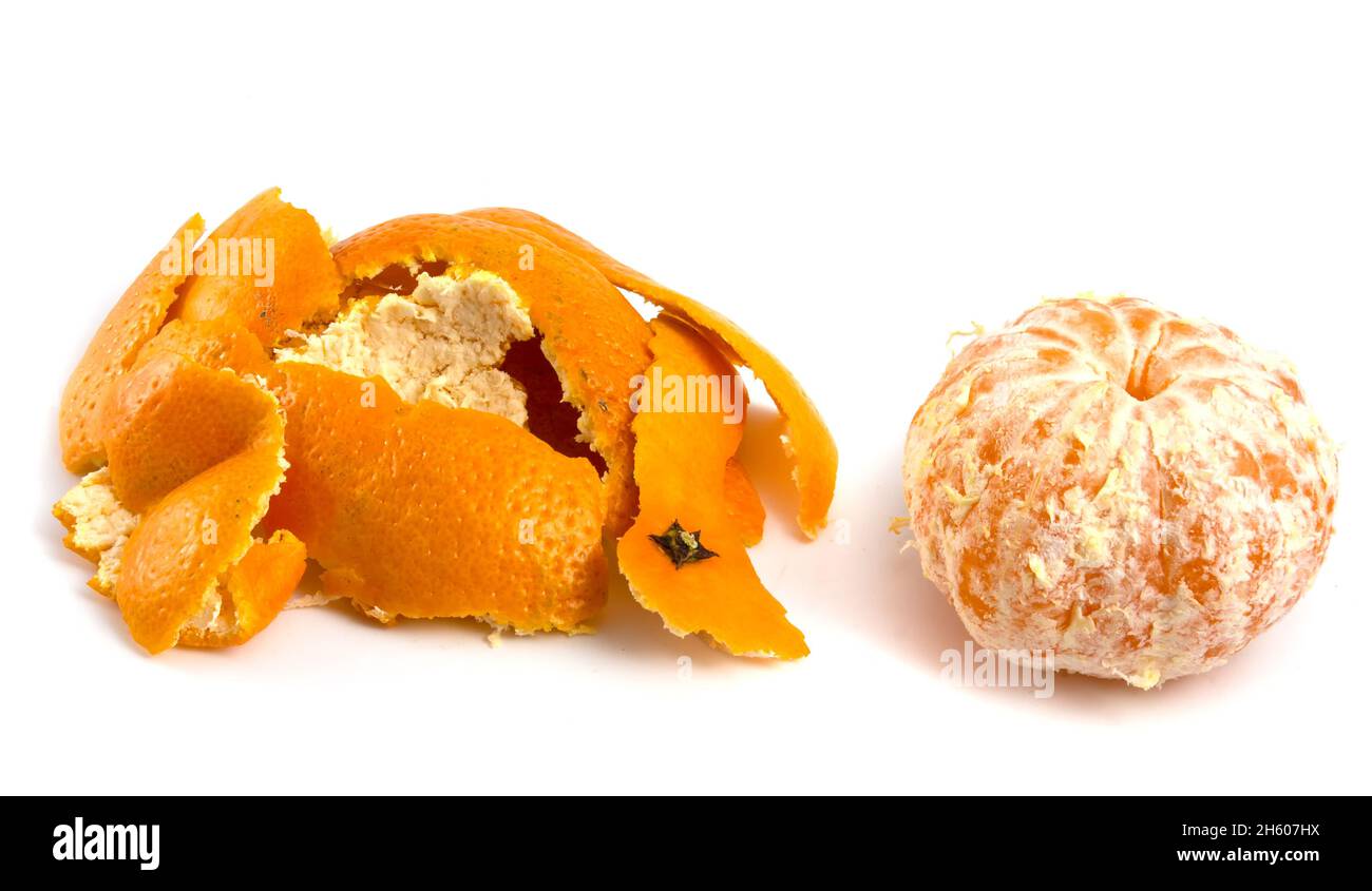 Peeled tangerine and peel isolated on white background. Stock Photo