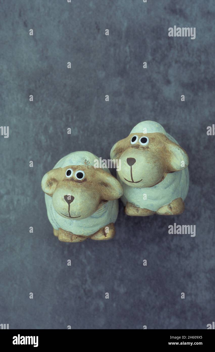 Two caricature models of sheep looking inquisitively  to viewers left Stock Photo