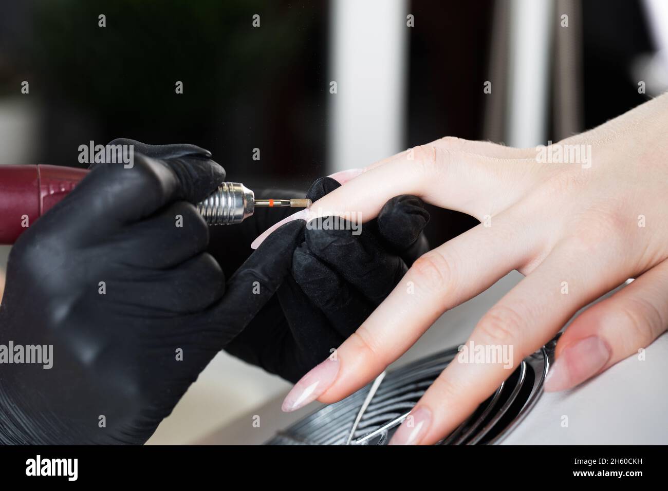 Hardware manicure. Manicure process, cuticle removal with a cutter