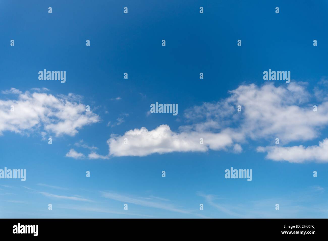 Background with blue sky and white clouds. Stock Photo