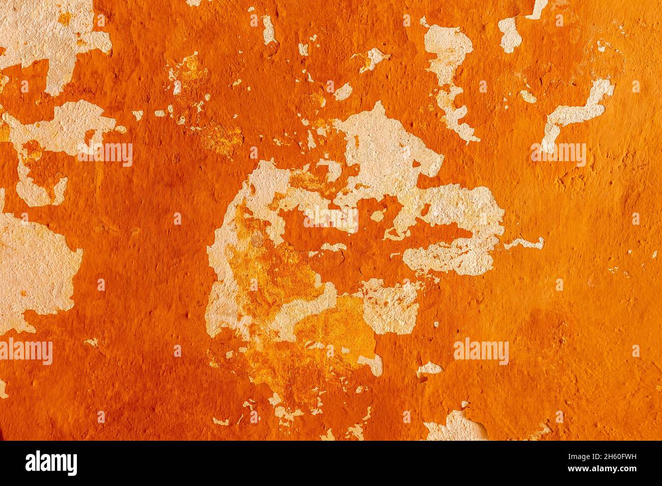 Old concrete wall with cracks and chipped texture. Stock Photo