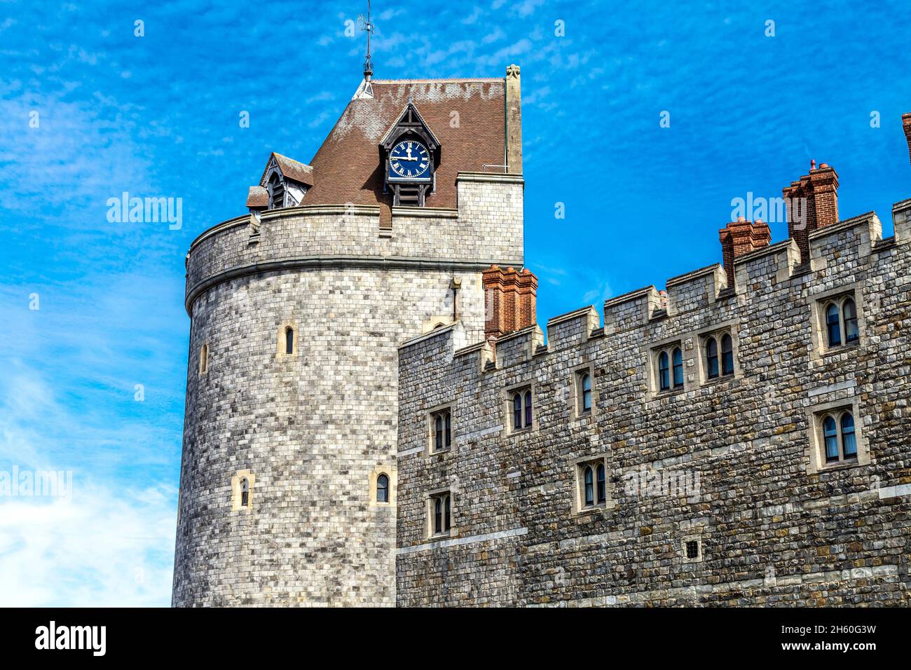 Clock on the exterior of the royal residence, medieval 11th century Windsor Castle, Windsor, Berkshire, UK Stock Photo