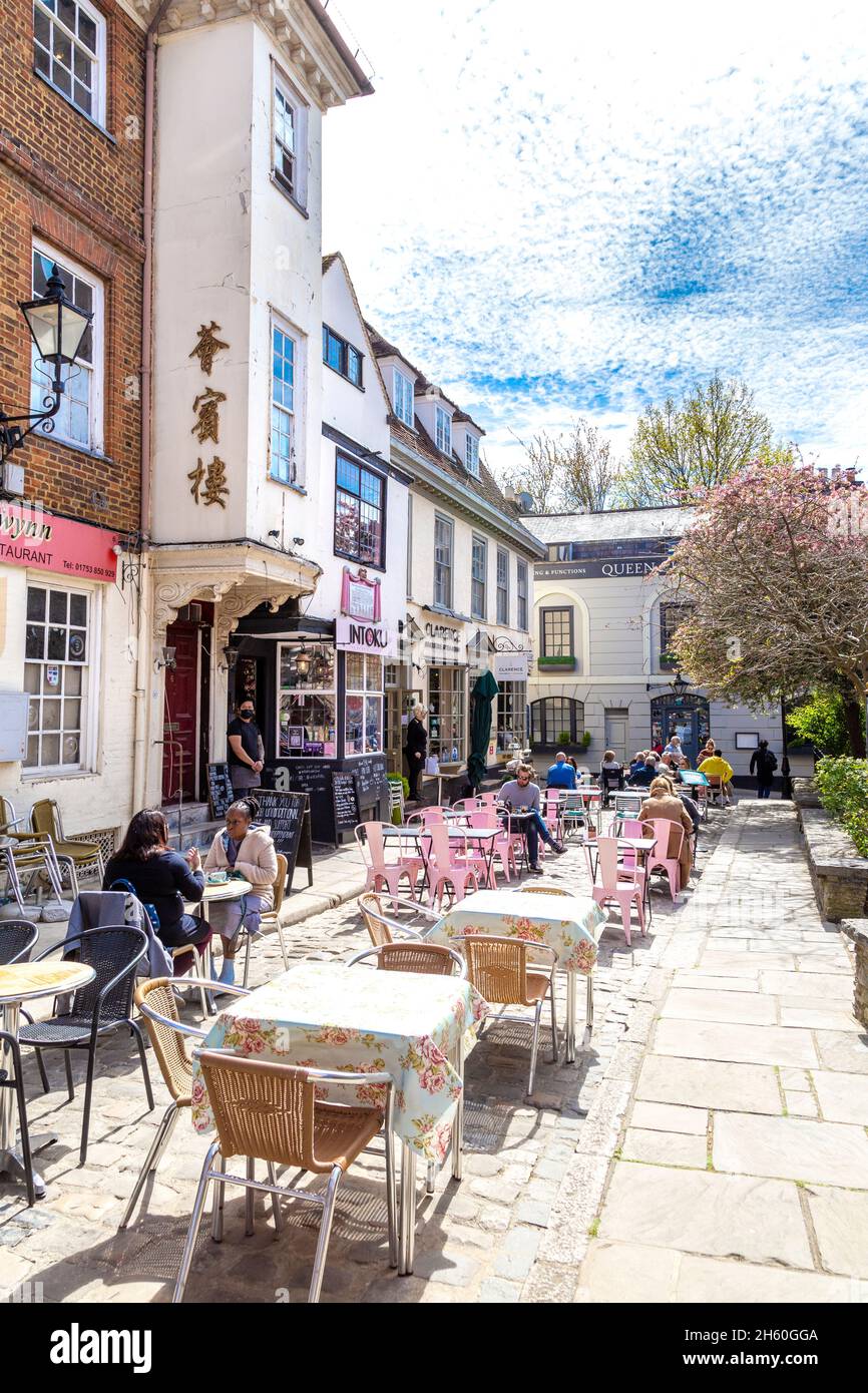 Tables outside restaurants for al fresco dining on Church Street, Windsor, Berkshire, UK Stock Photo