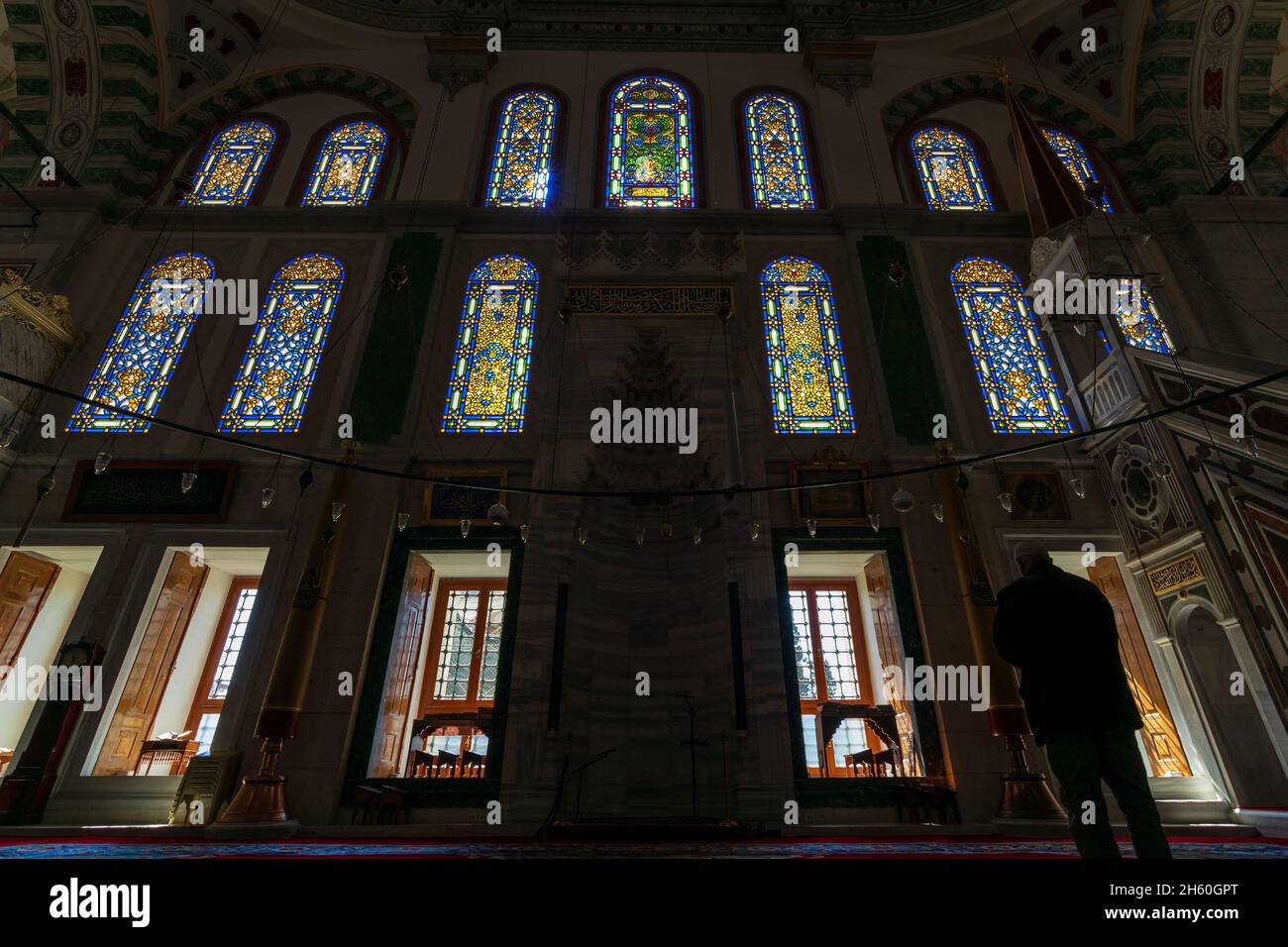 Silhouette shot of group of colorful stained glass at public ottoman Fatih Mosque, located in Fatih district of Istanbul, Turkey Stock Photo