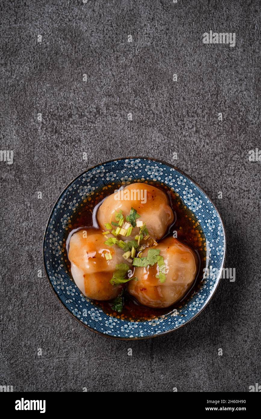 Top view of Bawan (Ba wan), Taiwanese meatball delicacy, delicious street food, steamed starch wrapped round shaped dumpling with pork and shrimp insi Stock Photo