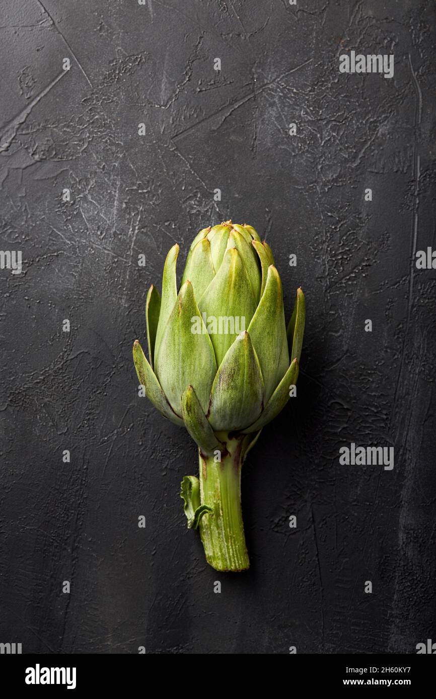Artichokes on a black background. Stock Photo
