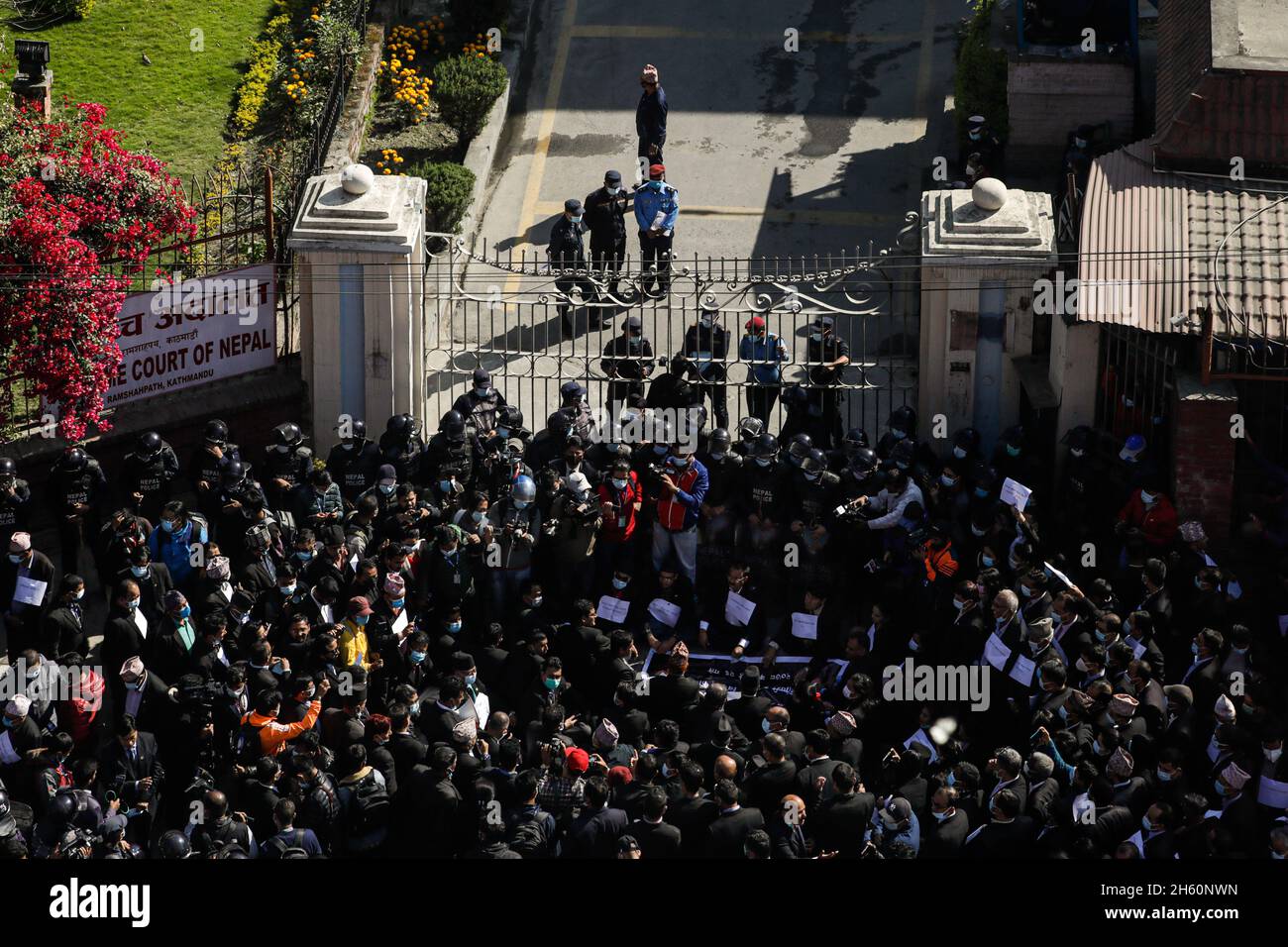 Kathmandu, Bagmati, Nepal. 12th Nov, 2021. Lawyers of the Nepal Bar Association stage a protest infront of the entry gate to prevent Chief Justice CHOLENDRA SHUMSSHER RANA from entering the Supreme Court of Nepal, seeking his resignation, in Kathmandu, Nepal on Friday, November 12, 2021. Justices of Supreme Court along with the lawyers from Sunday has come onto the protest demanding resignation of CJ Rana who has been alleged of politicking and bench shopping further corrupting the judicial system of the nation. Credit: Amit Machamasi/ZUMA Wire/Alamy Live News Stock Photo
