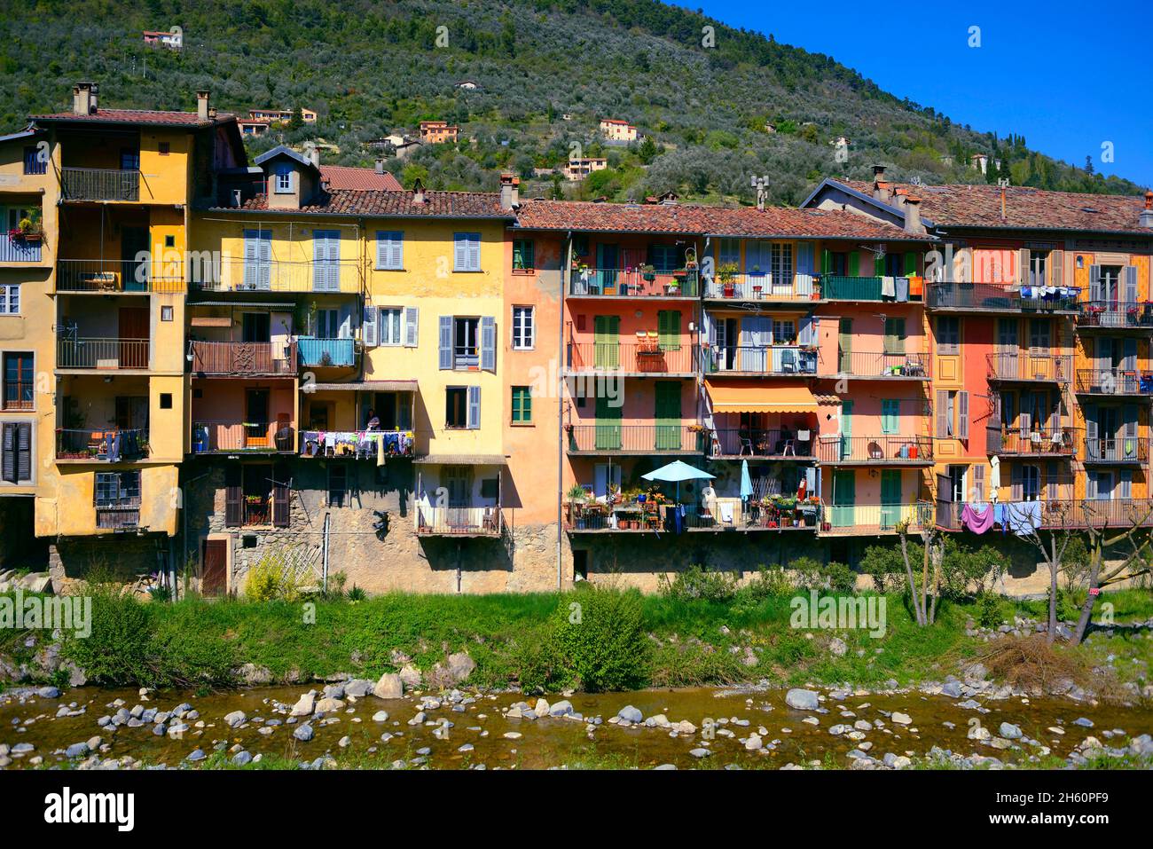 FRANCE, ALPES MARITIMES ( 06 ), SOSPEL, THE COLORED HOUSES OF SOSPEL WITH BEVERA RIVER Stock Photo