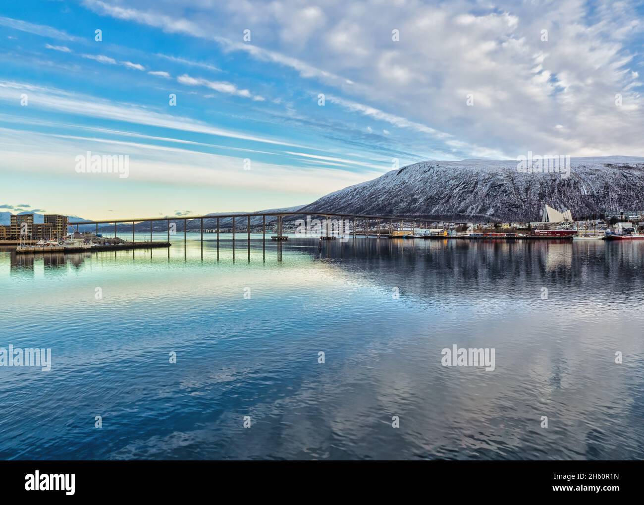 Beautiful big skies over Tromso on a clear winter day, looking towards Tromso Bridge and the iconic Arctic Cathedral. Stock Photo
