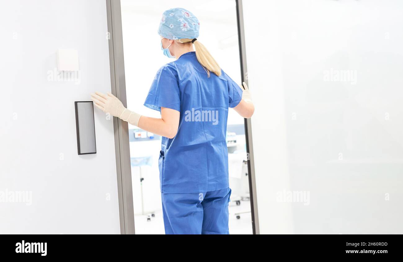 Nurse or doctor in front of the operating room or when changing shifts in the clinic Stock Photo