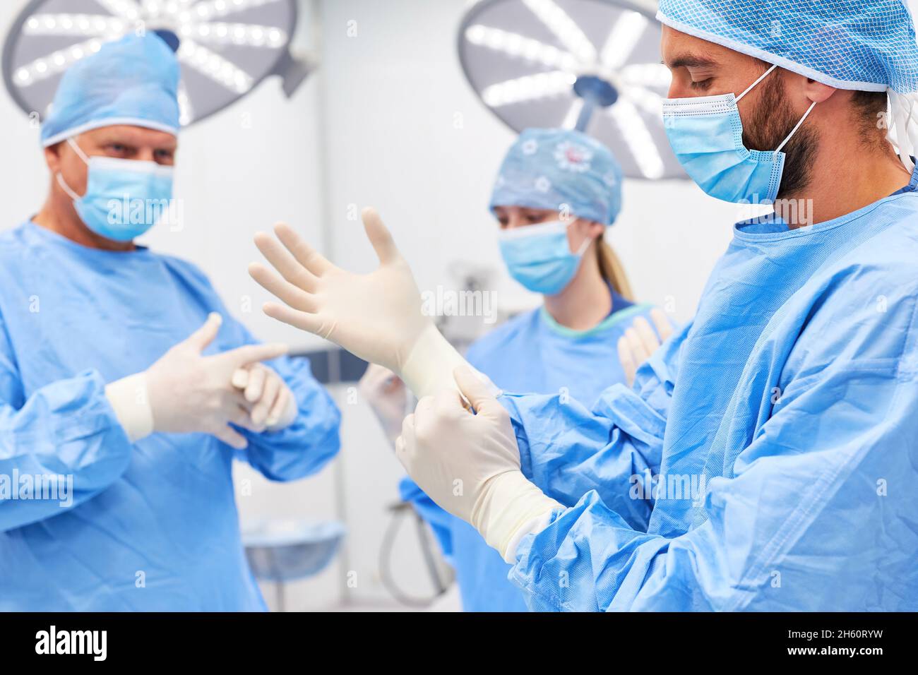 Surgeons put on disposable gloves as hygiene before surgery in the hospital Stock Photo Alamy