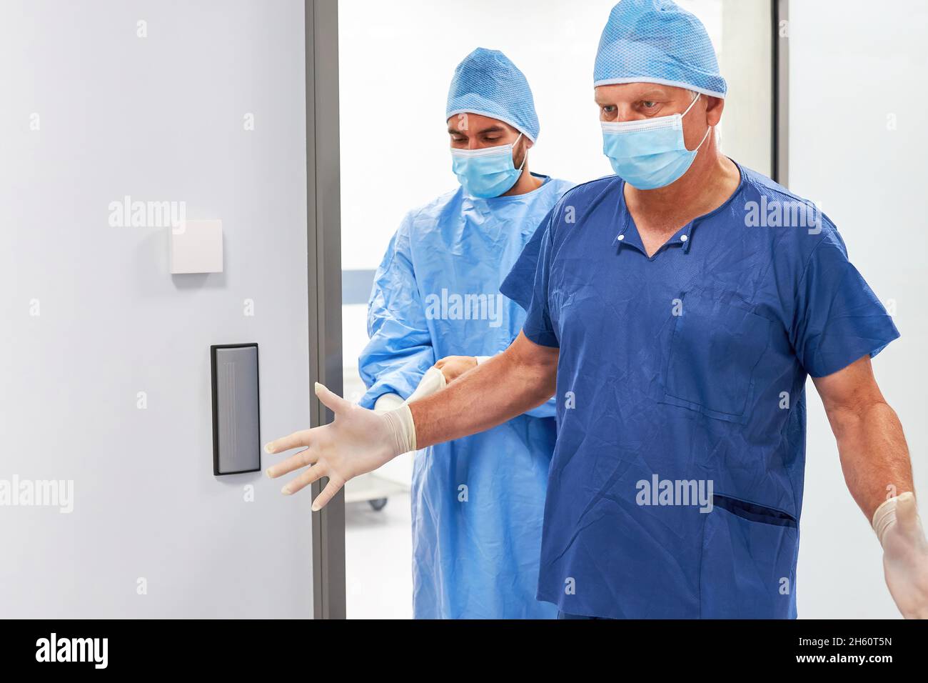 A helpless and exhausted surgeon and assistant doctor after a strenuous operation Stock Photo