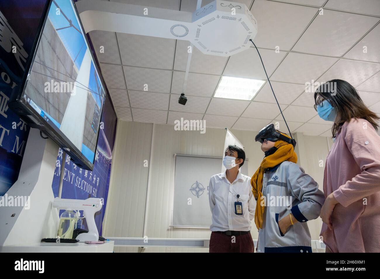 Maran, Malaysia. 9th Nov, 2021. A worker demonstrates the Virtual Reality (VR) simulation training at a Safety Training Center of the East Coast Rail Link (ECRL) project Section 6 campsite located in Maran, Pahang, Malaysia, Nov. 9, 2021. TO GO WITH: 'Feature: Immersive VR technology in use for Malaysian mega railway project's safety training' Credit: Zhu Wei/Xinhua/Alamy Live News Stock Photo