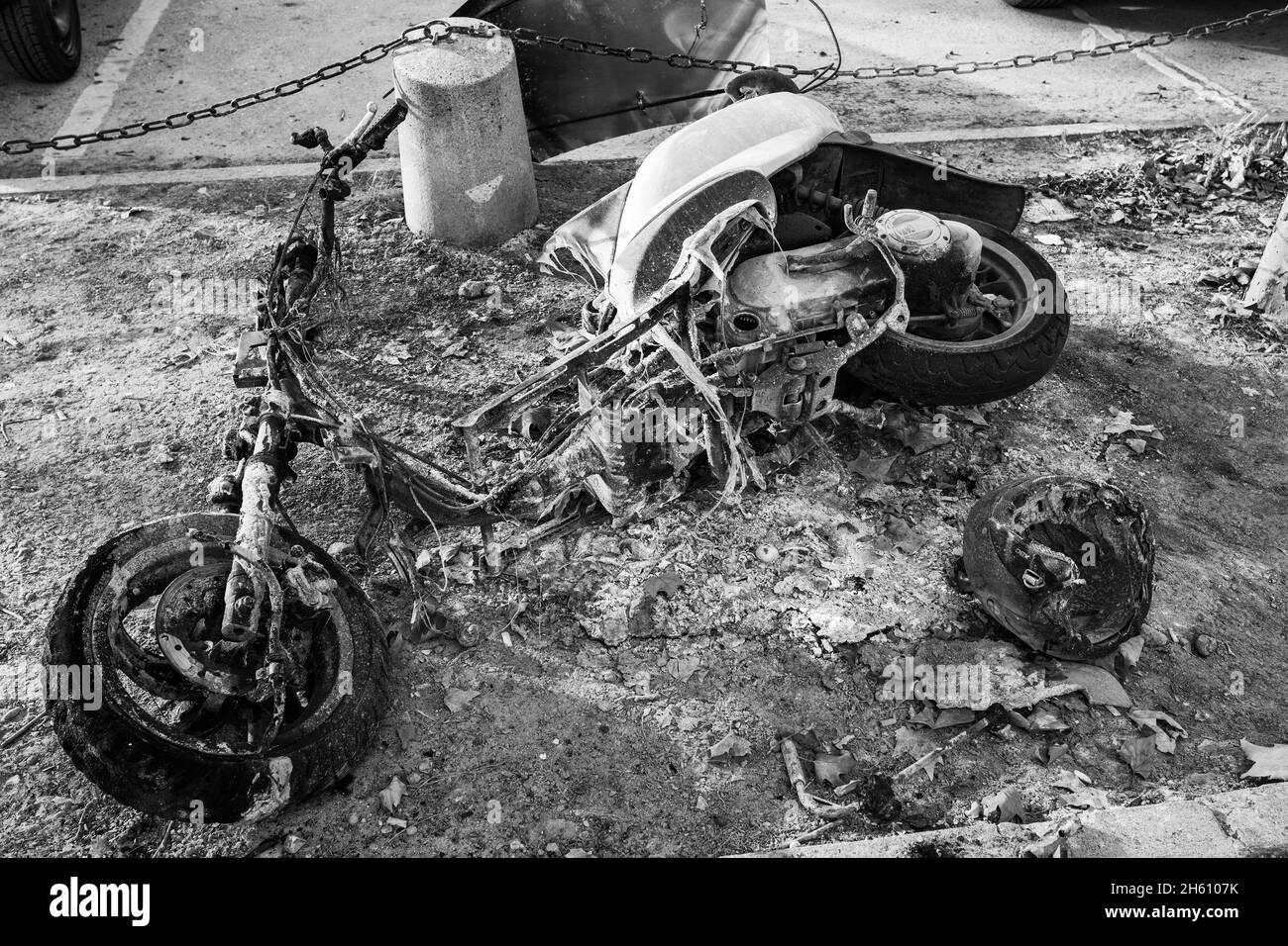 Burnt out motor scooter close-up. Black and white photography Stock Photo