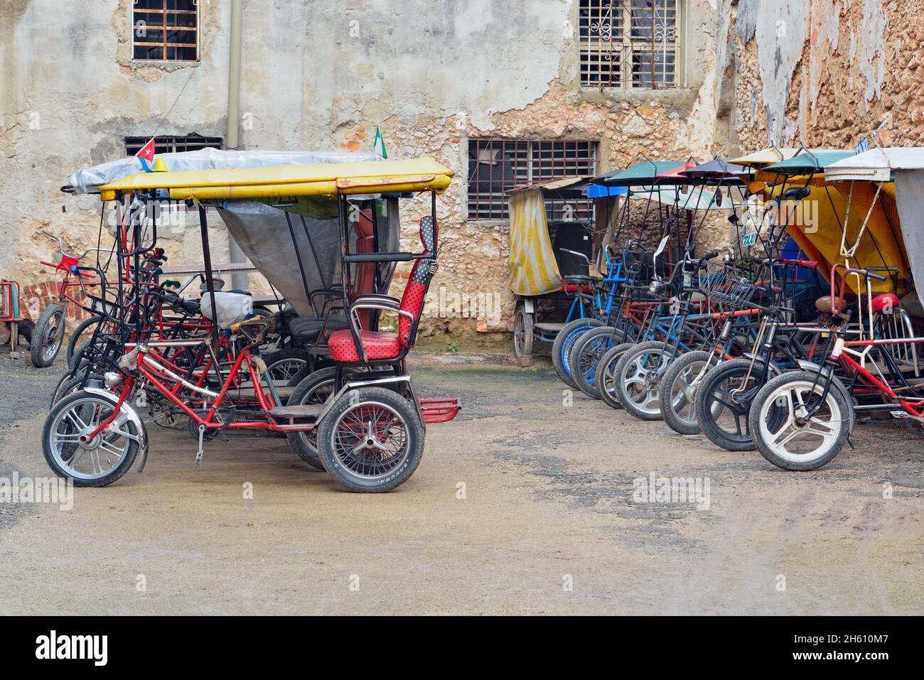 Street scene in central Havana.  Overnight parking for bicycle taxis, La Habana (Havana), Habana, Cuba Stock Photo