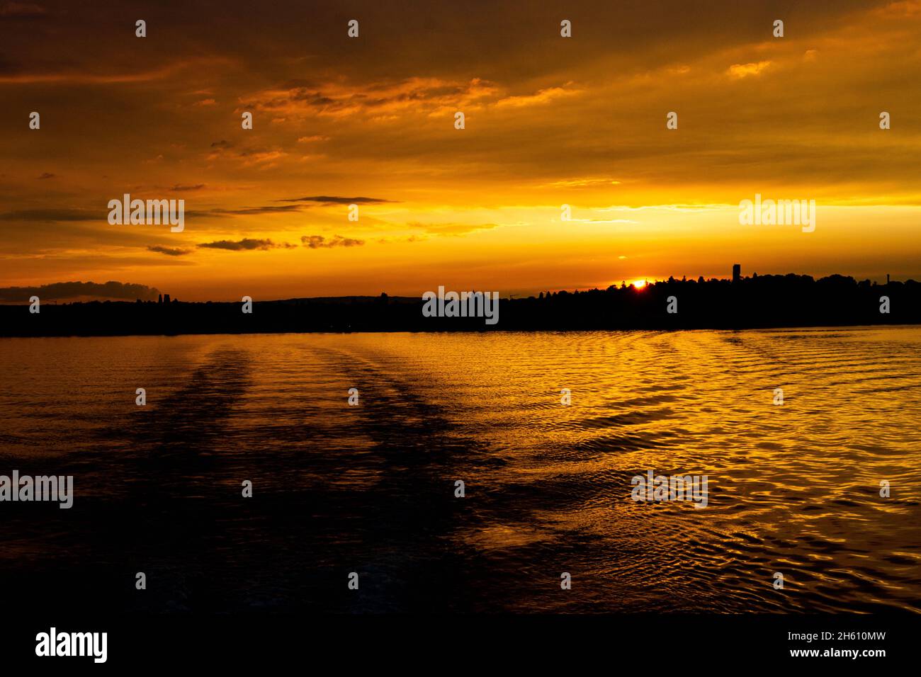 Beautiful view of the cloudy sunset sky over a sea Stock Photo - Alamy