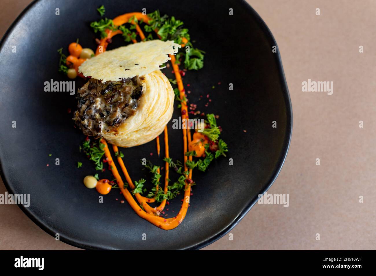 mushrooms baked in the oven with grated cheese, graten Stock Photo - Alamy