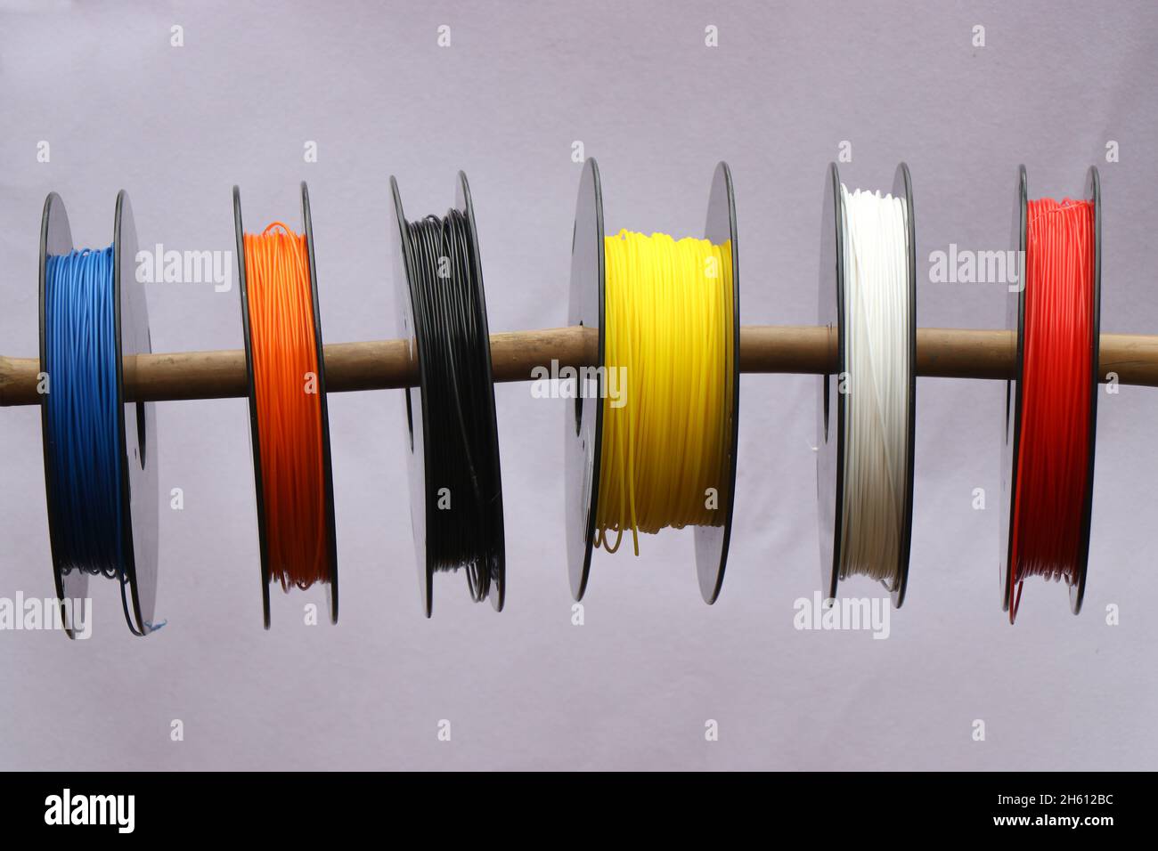 Reels of 3d printer filament for 3D printing or rapid prototype manufacturing methods Stock Photo