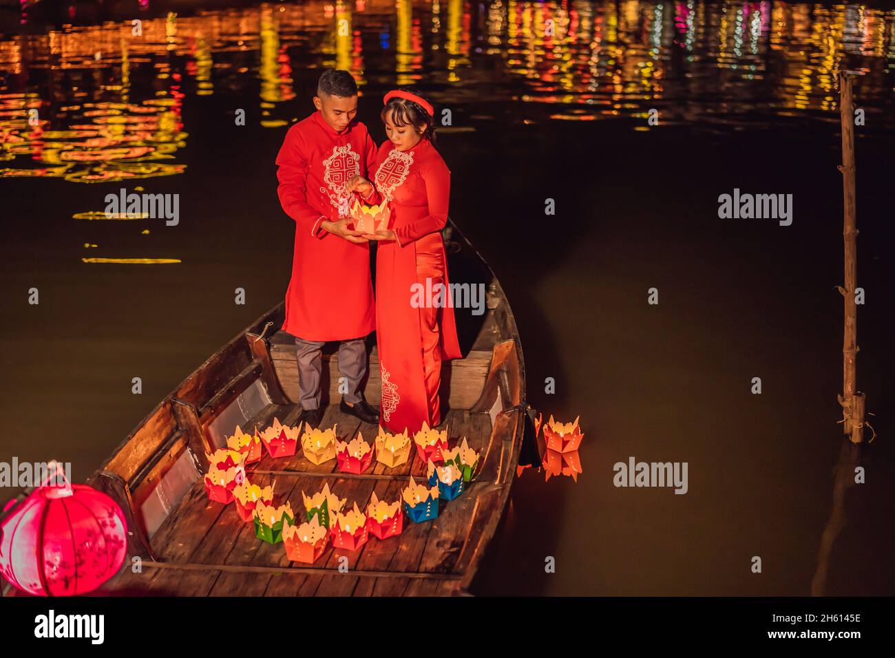 Hoi An, Vietnam, 27.12.2020: Happy couple of travelers ride a national ...