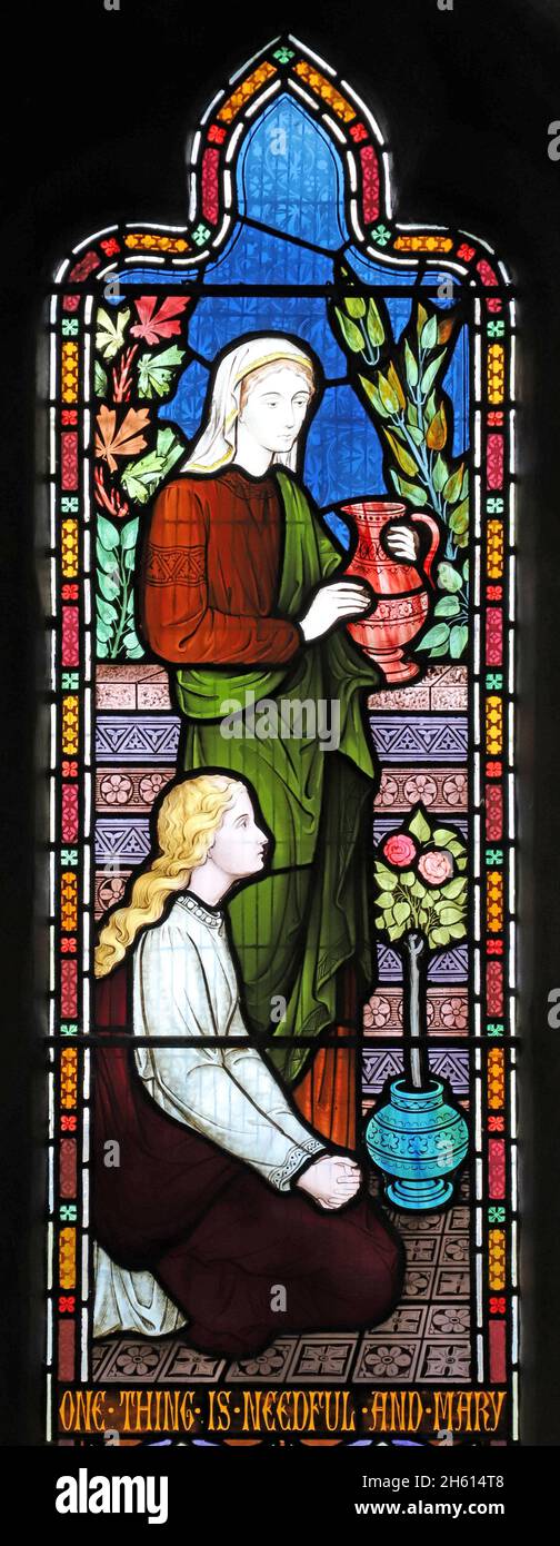 A stained glass window by Frederick Preedy depicting Acts of Mercy, St Andrew's Church, Cleeve Prior, Worcestershire Stock Photo