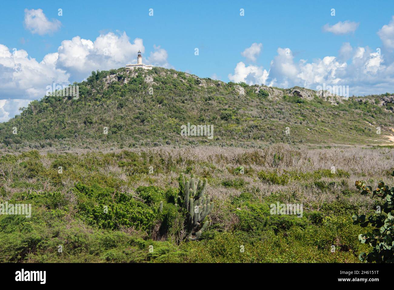 The Caja de Muertos Lighthouse can be seen on the top of a hill on the Island of Caja de Muertos off of the coast of Ponce in Puerto Rico. Stock Photo