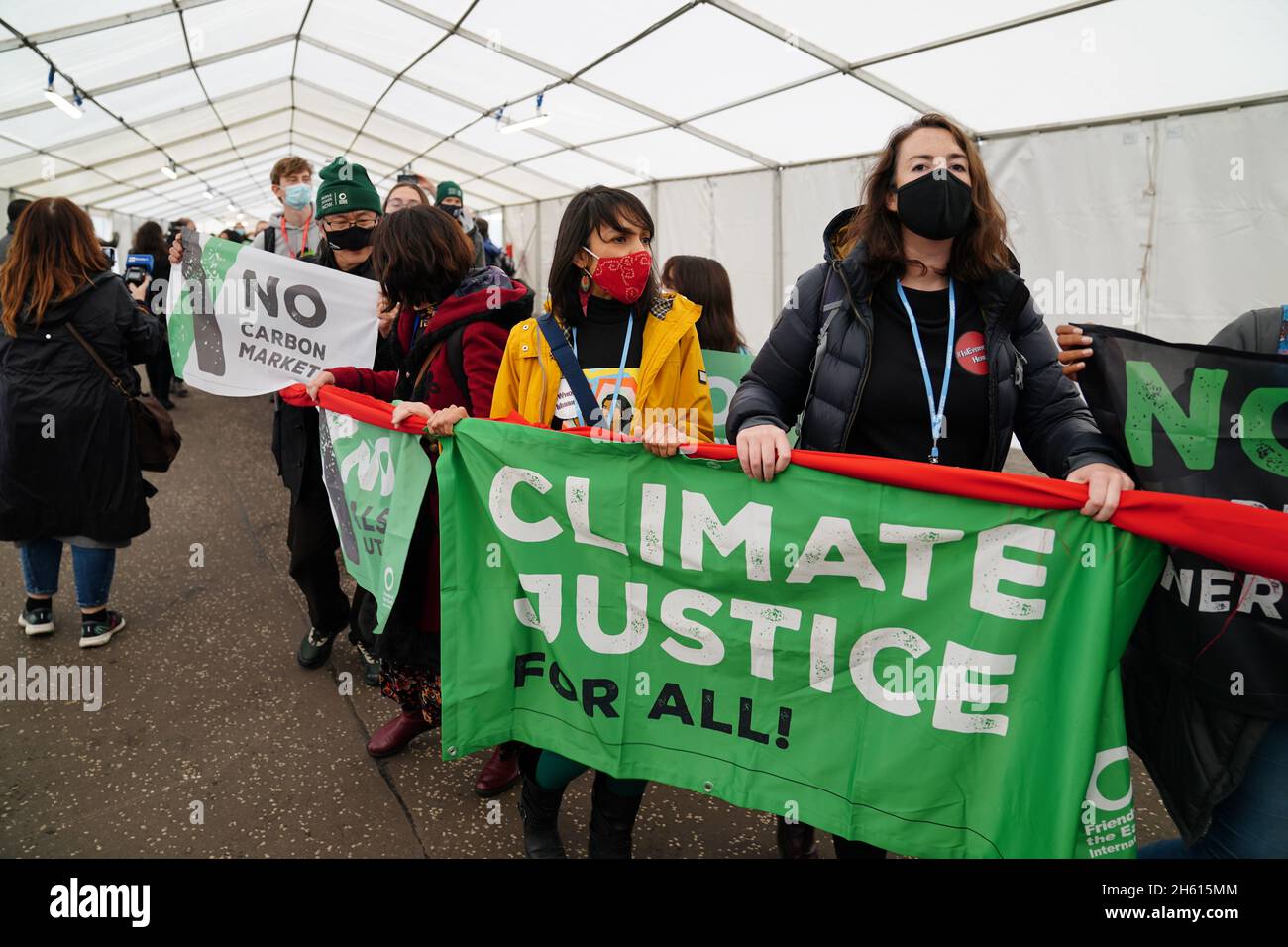Climate activists hold a demonstration in the venue during the official ...